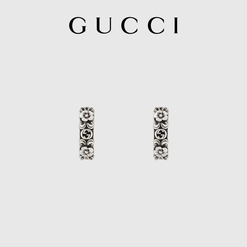 G*u*i earrings